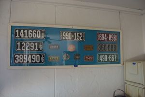 lot 324 image: Vintage Texas license plates in framed shadow box