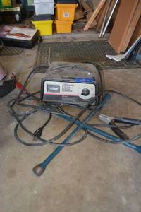 lot 403 image: Battery charger starter and X wrench