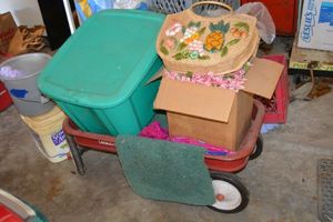 lot 401 image: Radio Flyer red wagon, straw hand bag, artificial flowers, green tote and pink umbrella