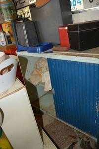 lot 383 image: Garage storage cabinet with sliding doors, screwdriver set, pet feeder, rags, 8 track holder