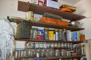 lot 398 image: Garage shelf contents - hardware, marbles, mitre box, tins, ammo box with hinges