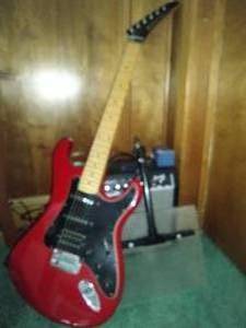 lot 233 image: Electric Guitar (Kramer XL III) with Fender amplifier, pedal and music stand
