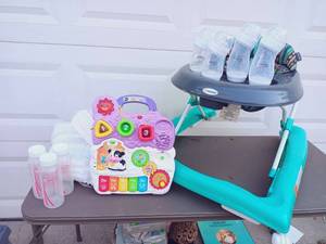 lot 8 image: Baby Set - Walker, Bottles, Diapers, & Toy