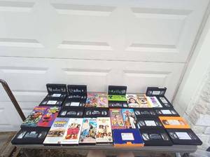 lot 81 image: 34 Piece VHS Set Including Fraggle Rock, The Best of Elmo, Harry and the Hendersons,  Andre, Good Boy The Wizzard of OZ, Bethovens 2nd, Dr. Dolittle 2,  Baby Geniuses, Bingo, and MORE