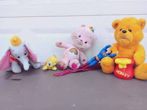 lot 51 image: 5 Piece Vintage Toy Lot Care Bears Pink Cheer Bear, Disney Dumbo Plush, Looney Tunes Tweety Bird, Superman Plush, and Liberty Honey Bear