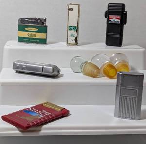 lot 23 image: Vintage Lighters & Wine Toppers