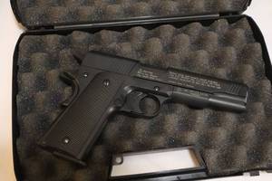 lot 30 image: Umarex Colt Government 1911 A1  (Replica) CO2 .177 Pellet Pistol, Carrying Case, CO2 Cartridges, Pellets, and Rotary Magazines
