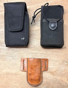 lot 122 image: Uncle Mikes Sidekick Nylon Radio Holder W Snap Size 2, Nite-Ize Cell Phone Holster, and Hand-Made Leather Sheath