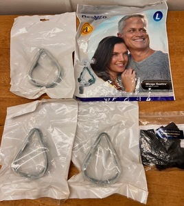 lot 150 image: Assorted CPAP Supplies - Including NEW ResMed Mirage Quattro Mask, Headgear, and Three Cushions &amp Clips
