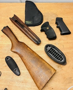 lot 210 image: Pistol Grips, Sticky MD-3 Holster, & Rifle Parts