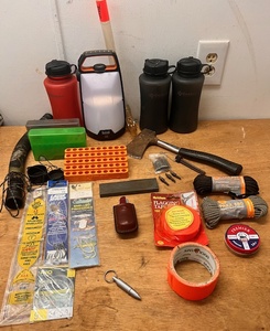 lot 289 image: Outdoors Man Lot - Including Primos Pack Bugle Model 913, Multi-Tool Knife, &amp Bushnell TRKR A1000L LaternFlashlight and Much More