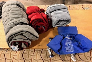 lot 324 image: Three (3) Sleeping Bags &amp Infant Buoyant Vest