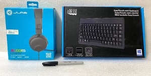 lot 21 image: Lot Of 2 - New Other Adesso 12 87 Key Easy Touch Mini Membrane Keyboard & JLab JBuddies Kids Headphones - As Shown