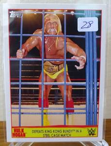 lot 28 image: 2015 Topps WWE Hulk Hogan Tribute #3 Defeats King Kong Bundy in a Steel Cage, $$