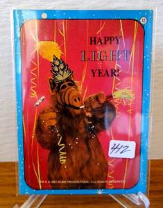 lot 412 image: 1987 Topps Alf Series 1 Stickers Happy Light Year #12 NRMT