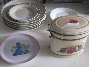 lot 33 image: Southampton stoneware collection plates -  5 dinner plates,  2 saucers,  Winnie the Pooh toddler plates, fruit design canister