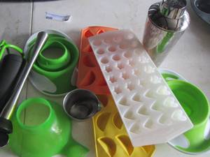 lot 49 image: apple cutter, ice cube molds, martini shaker, and more