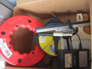 lot 81 image: steel tape 50ft, gas can, and other tools