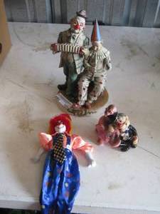 lot 103 image: clown figurine, 2 other clowns