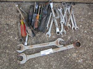 lot 203 image: screw drivers and socket drivers plus various size wrenches