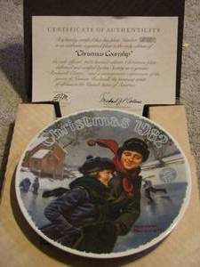 lot 219 image: Norman Rockwell Christmas 1981 plate-Scotty plays Santa 1980- Somebodys up there Christmas plate 1979- plus 1 all with certificates