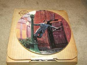 lot 231 image: Knowles Plates- Singing in the Rain # 651 A-- Good Morning # 885A-- Broadway Melody #1868A-- Of A Puzzlement #13572H-- Shall We Dance #9832.A-- Were Happy Again #1221A