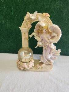 lot 45 image: Angel and globe figurine