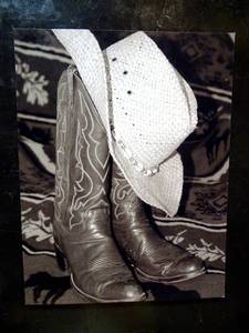 lot 108 image: COWBOR BOOT AND HAT BLACK AND WHITE PHOTO - 8.5 X 11
