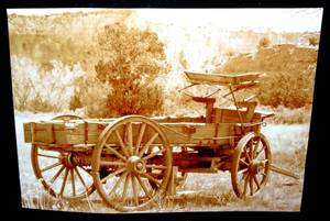 lot 134 image: ORIGINAL SEPIA WAGON PHOTO by HORIZONS LIGHT PHOTOGRAPY  - MEASURES 13 X 19