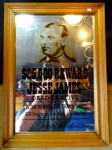 lot 249 image: GREAT WESTERN OR BAR ROOM WALL MIRROR - JESSE JAMES WANTED REWARD - FRAMED 13 X 19