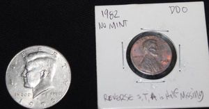lot 16 image: Coins 1995 P Kennedy Half Dollar off Center Error, 1982 No mint mark Penny Ddo Rerverse S,T,& A Half Misssing