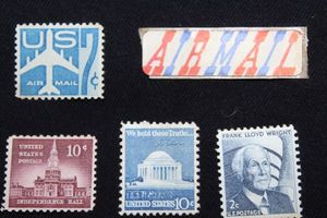 lot 19 image: Stamps Vintage Silhouette of Jet USPS Air Mail, Vintage Independence Hall .10 cent Stamp, Vintage Jefferson Memorial .10Cent and Vintage Frank Lloyd Write .2cent USPS Stamps