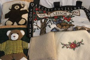 lot 121 image: Linens Teddy Bear Quilt, Needs Repaired, Bear Wall Dcor, and Poinsetta Throw