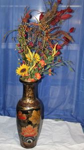 lot 17 image: Black and Gold Asian Inspired Resin Vase with faux Floral Arrantment