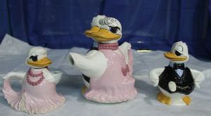 lot 4 image: Vintage Kitsch Male and Female Ball Dancing Duck Teapot Set with Cream and Sugar Dish