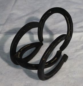 lot 8 image: Small Rocking Chair made of Horseshoes