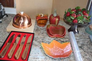 lot 252 image: Vintage Apple Dishes, Plastic Leaves, Cheese Plate with Cover and Knife Set.