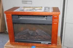 lot 313 image: Small Heat Surge Electric Fire Place