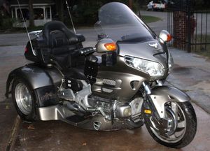 lot 1 image: 2002 Honda Goldwing 1800 Trike, Has new Battery Approx 94K Miles, Stored under Carport. Runs and Drives, Owner hasnt had any issues. More Information Below