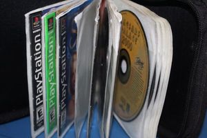 lot 325 image: Variety of Playstation Games in Case..Titles Shown in Photos