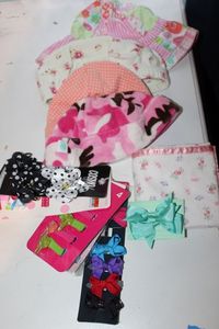 lot 346 image: Girls Infant Hats and Hair Bows still in packaging