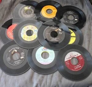 lot 58 image: Vintage Twenty 45 RPM 7 Inch Records including The Champs Tequila