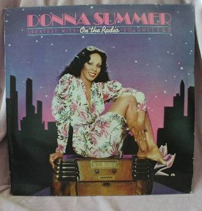 lot 43 image: Donna Summers On The Radio 78 RPMs 12 Inch Two Disc Vinyl Record with Cover and Sleeves