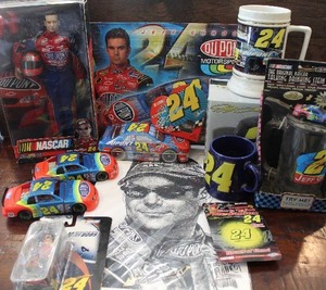 lot 28 image: NASCAR Jeff Gordon Number 24 Collectibles icluding Lego Car and New Ceramic 24 Coin Bank