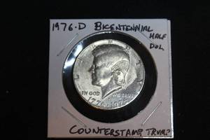 lot 211 image: 1976 D Bicentennial Kennedy Half Dollar COUNTERSTAMP Donald Trumps Profile