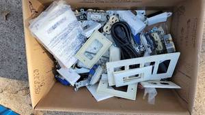 lot 216 image: Lot of Electrical Switches, Plugs, and Face Plates