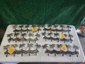 lot 56 image: Selection of metal palm tree decor. hanging hook racks