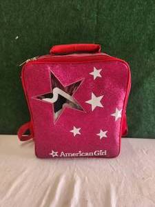 lot 72 image: American girl backpack full of clothes and accessories
