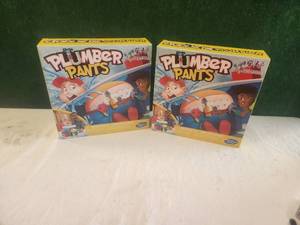 lot 120 image: Plumber pants games - qty. 2 - unopened