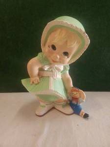 lot 142 image: Vintage ceramic girl holding raggedy Andy doll